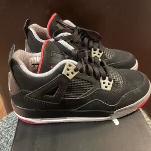 Authentic Jordan 4s Retro (2012) - Breds
Size 4Y grade school.